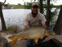 August Wells with a 22.0 lb common caught during session 4 of the Wild Carp Club of Austin, Texas.